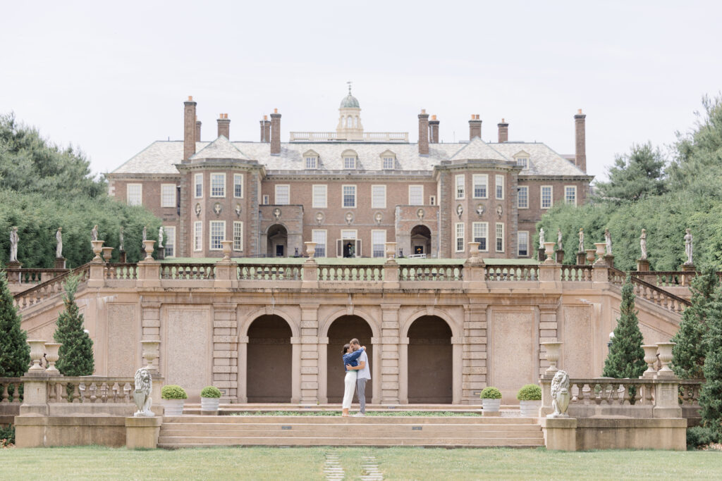 Couple hugging after surprise proposal at Crane Estate