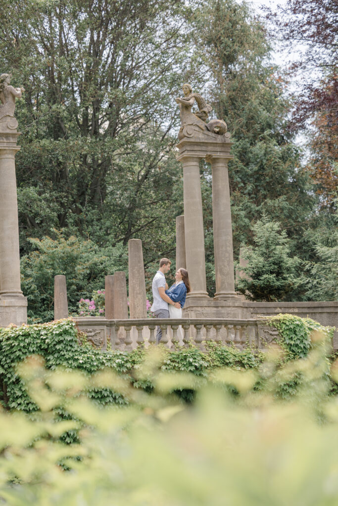 Couple embracing on a balcony at Crane Estate