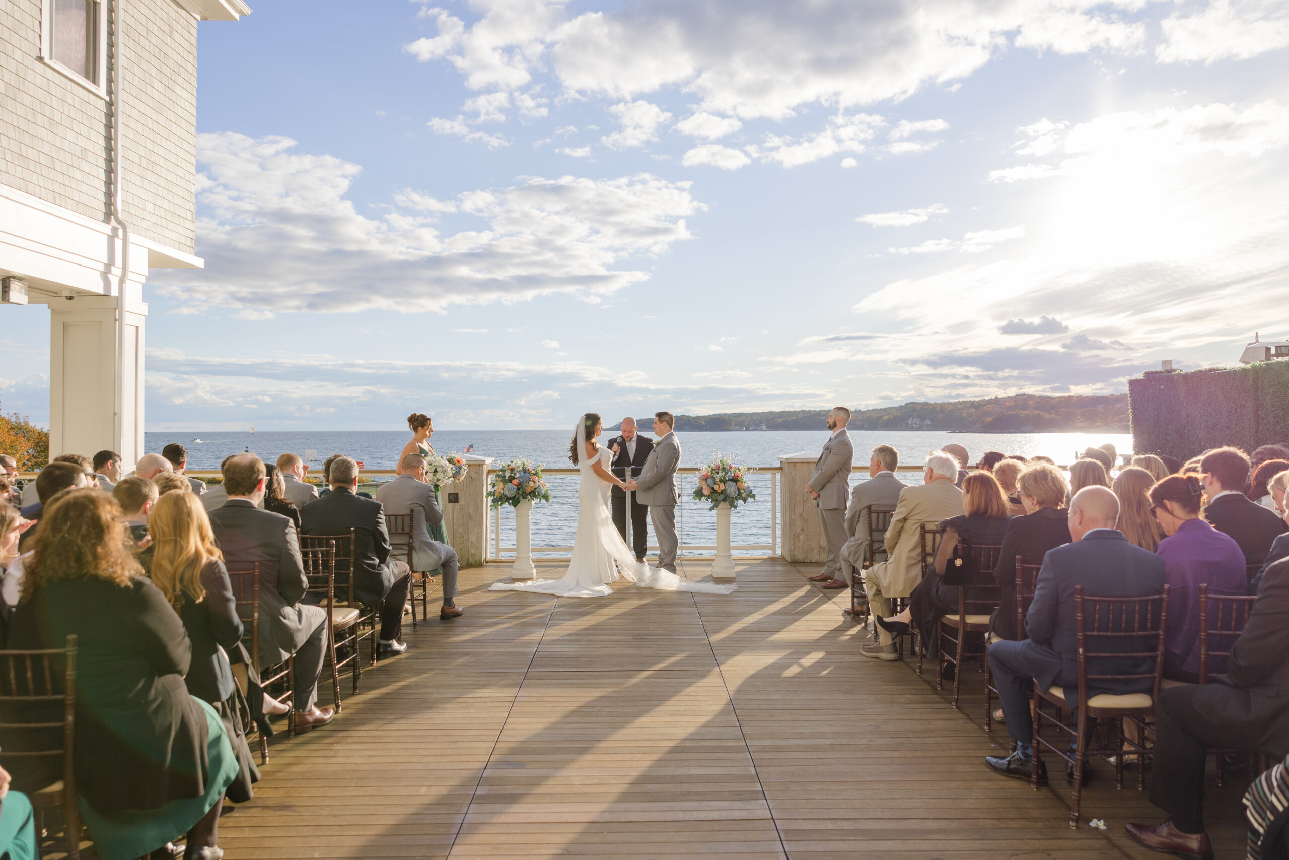 Couple exchanging vows during their wedding ceremony captured by a hands-on New England wedding photographer.